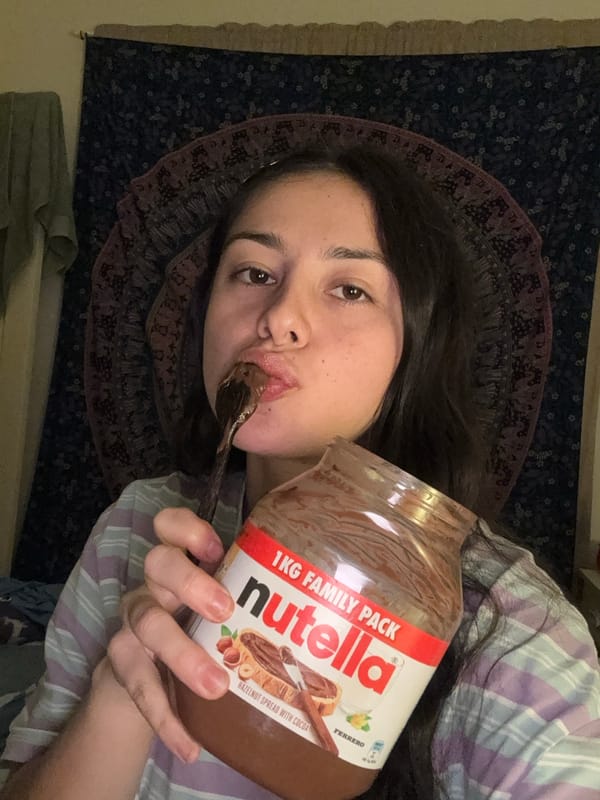 Person enjoys Nutella jar while lying down in Como