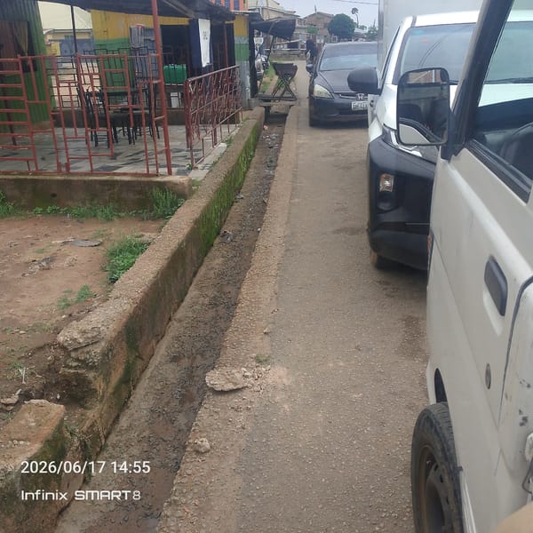Street life, cement runs, and roadside snacks in a West African neighborhood