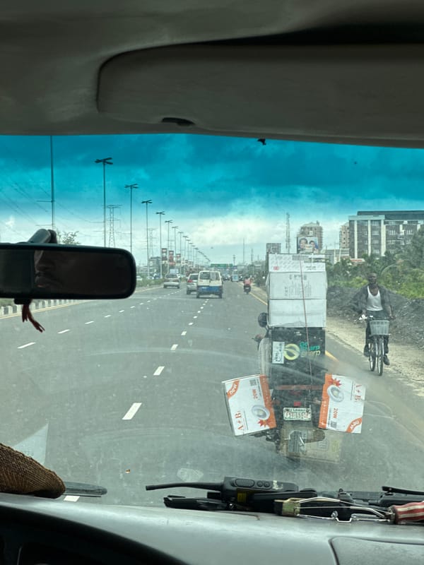 Cyclist carries boxes on highway in Igboefon, Nigeria