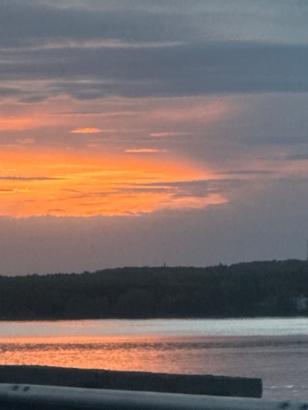 Sunset observed over water in Chaikovsky, Russia