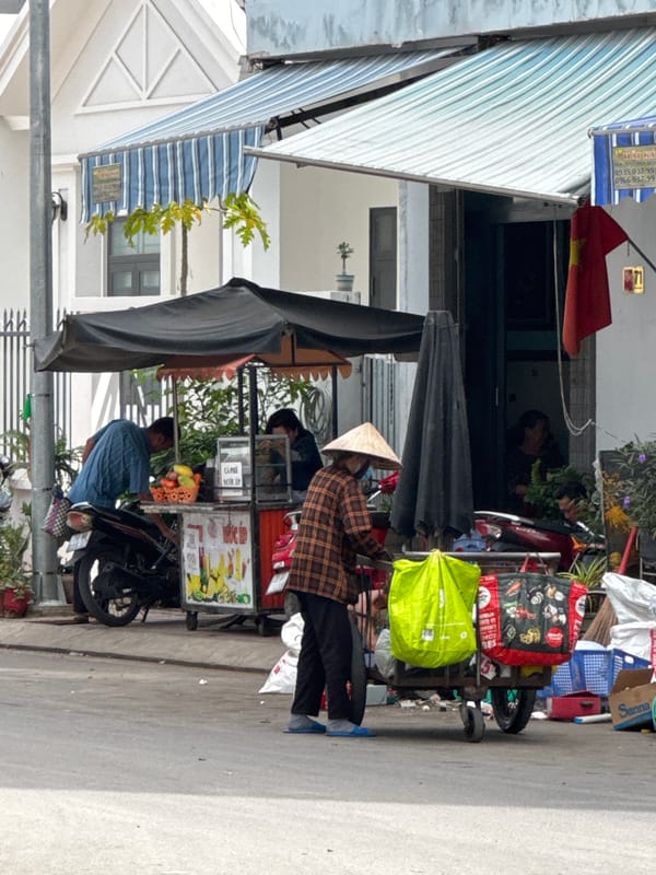Nha Trang street life: vendors, loaded bikes, and daily hustle