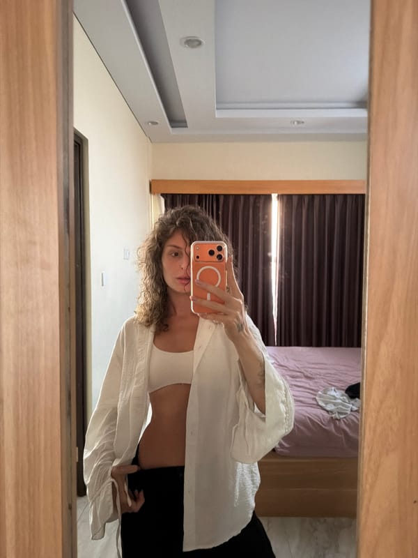 Woman takes selfies in North Kuta hotel room