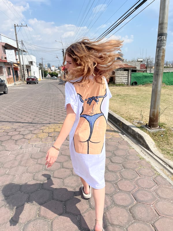 Woman in novelty shirt spotted on urban sidewalk