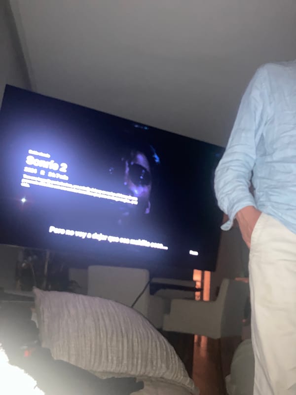 Late-night movie viewing of horror sequel captured in bedroom