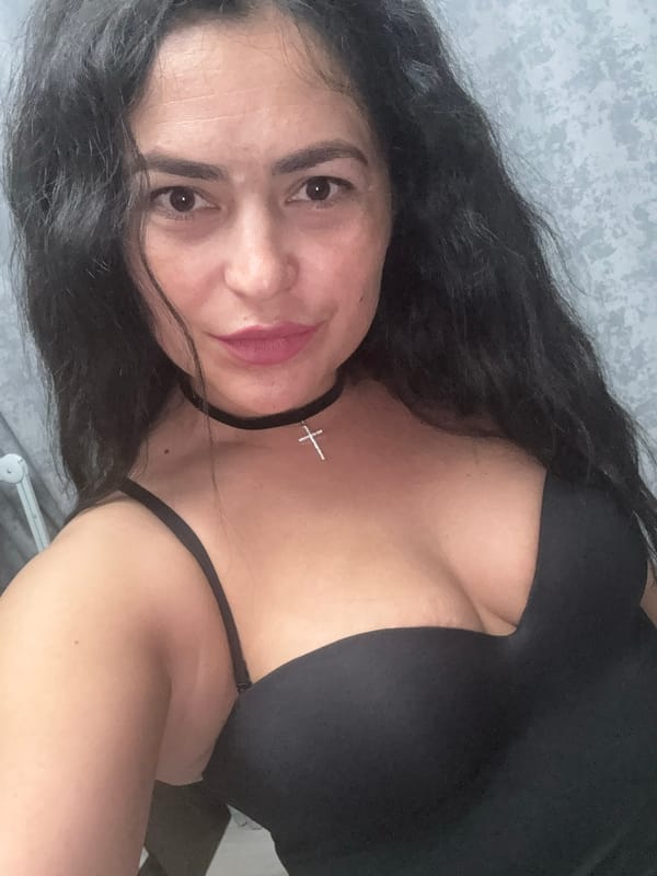 Woman takes selfies with dog in Russian home