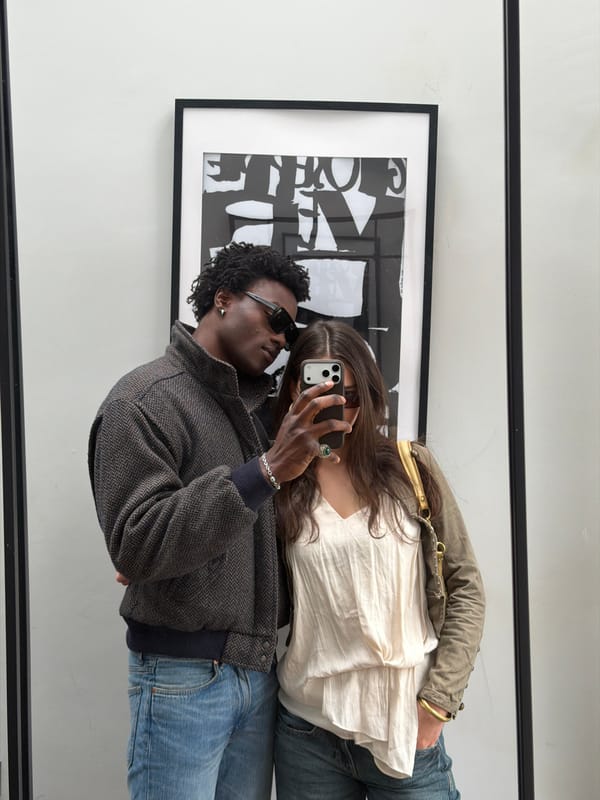 Couple Takes Mirror Selfie in London Room