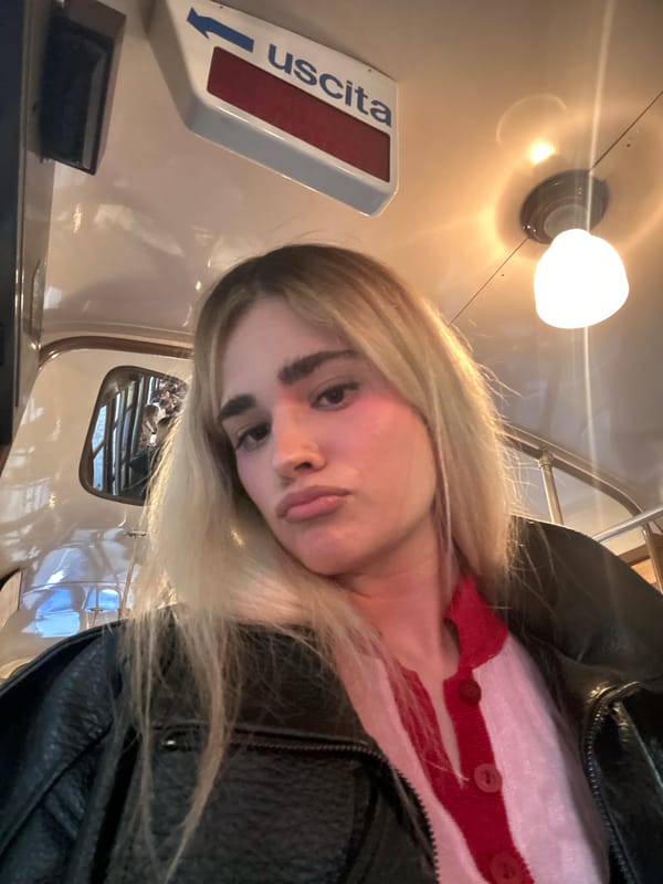 Woman takes selfies on historic Milan tram