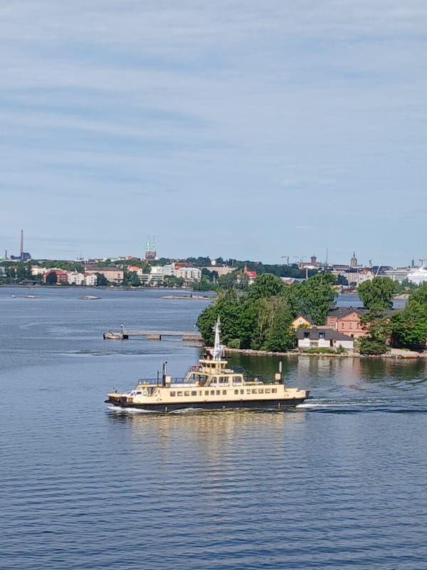 Ferryboat crossing Helsinki harbor with city skyline behind