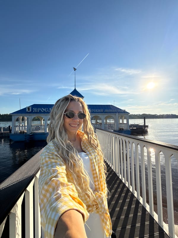 Woman and child enjoy sunny afternoon river cruise near Yaroslavl