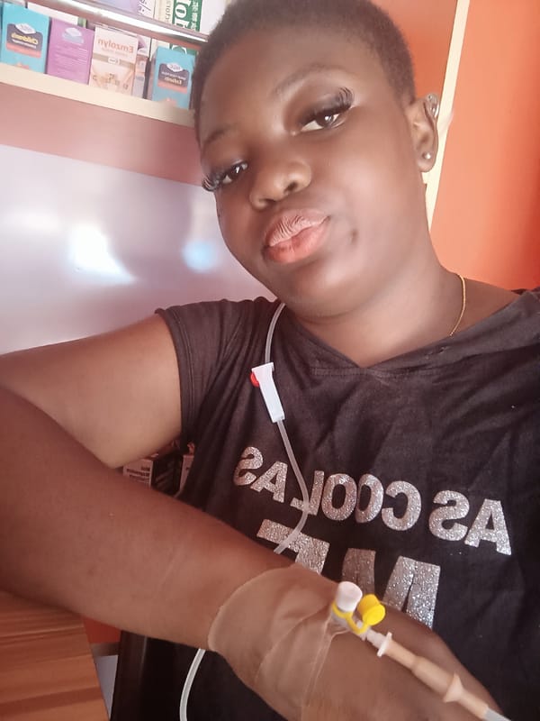 Woman with IV observed at medical facility