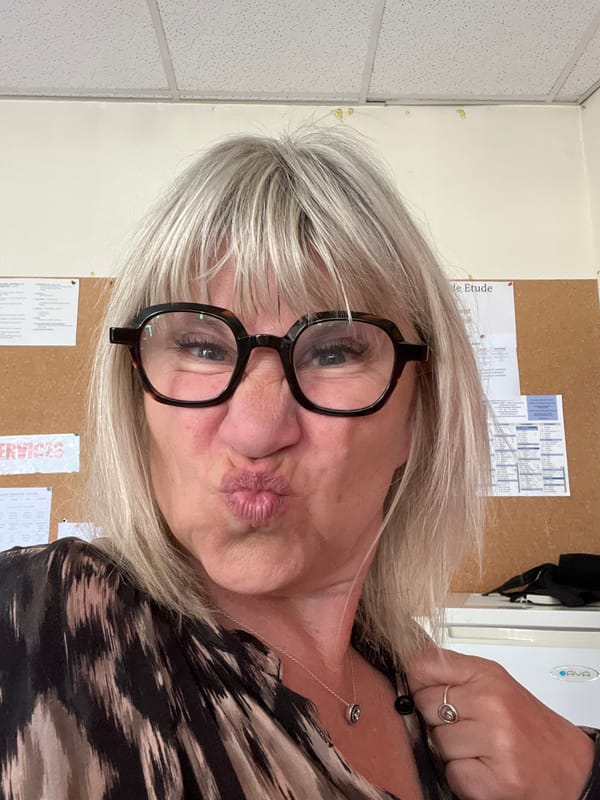 Woman makes playful kissy face in La Fouillouse