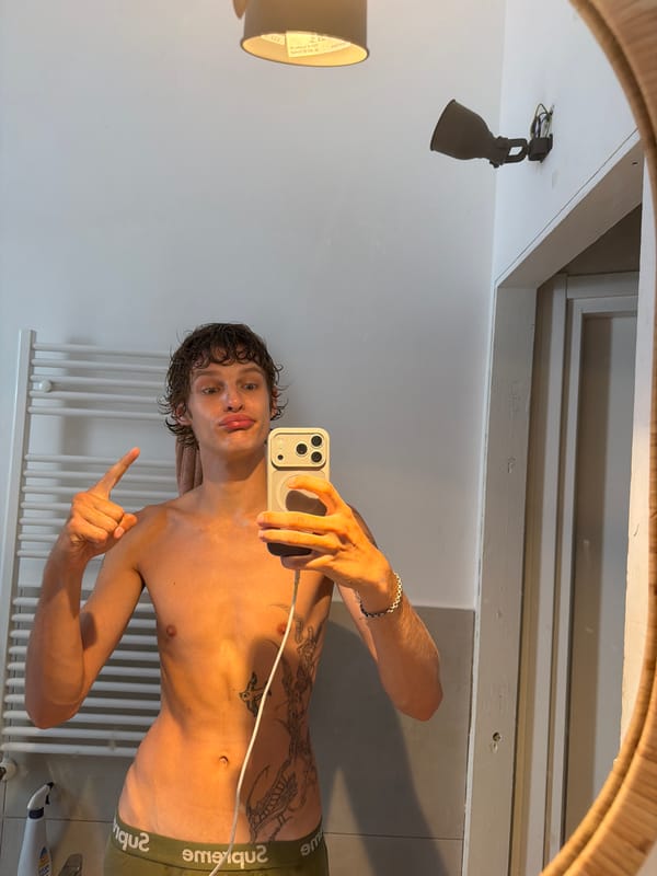 Casual bathroom mirror selfie in Milan apartment