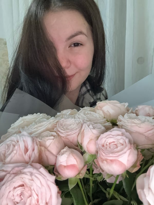 Woman receives pink rose bouquet in Foki, Russia