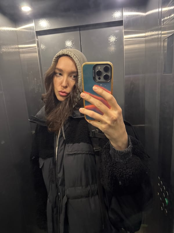 Woman takes selfie in Moscow elevator early morning