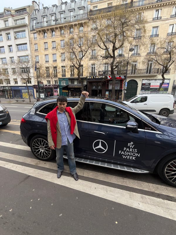 Man stands on crosswalk near Paris theater
