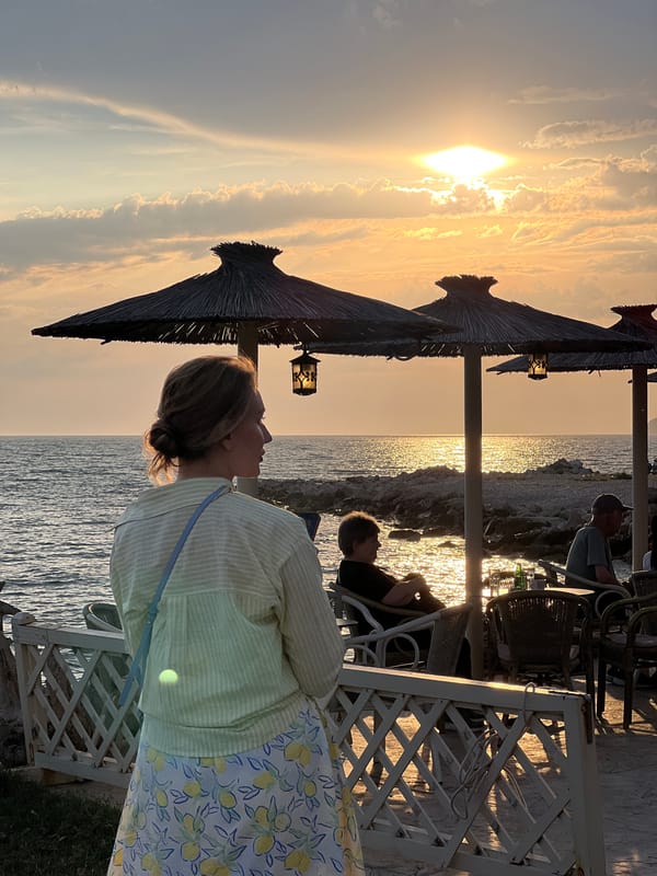 Women enjoy evening coastal views in Bar, Montenegro