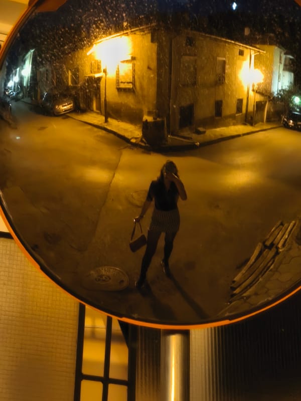 Night street intersection captured in security mirror, Blagoevgrad