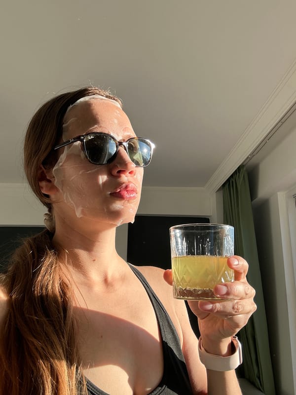 Woman applies skincare sheet mask in early morning Fethiye