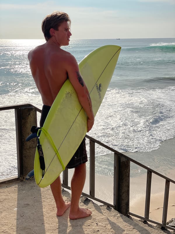 Morning surf session begins at Kuta Selatan beach