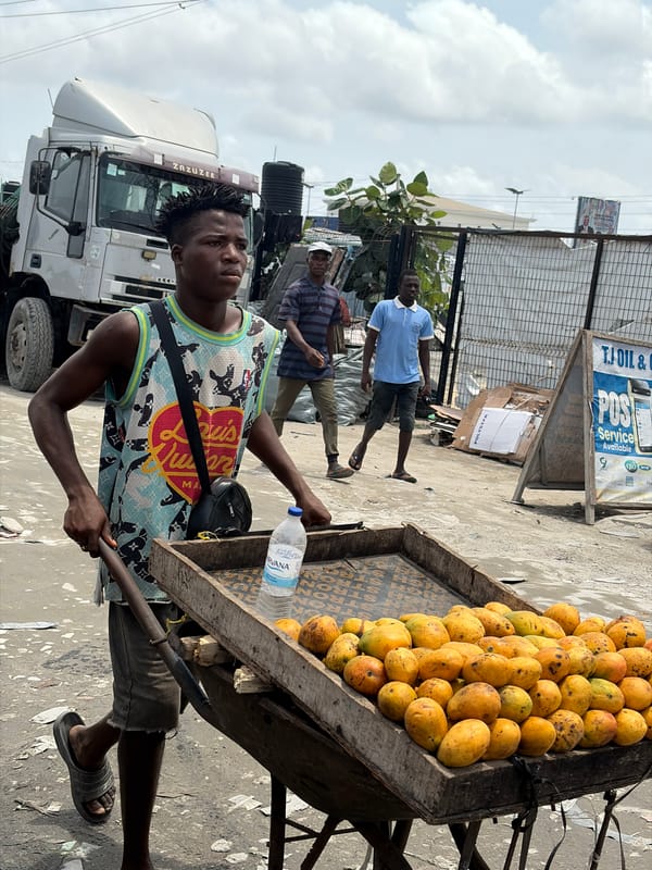 Street vendors sell mangoes, onions in Lagos neighborhood