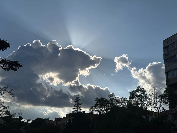 Dramatic sunbeams break through clouds over Dobrich, Bulgaria