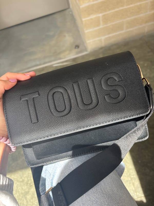 Person displays TOUS handbag in Rionegro, Colombia