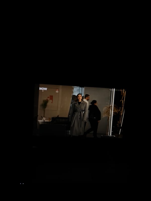 Person watches TV series in dimly lit room, Kragujevac