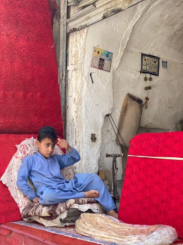 Market scenes across Kandahar showing vendors and produce stalls