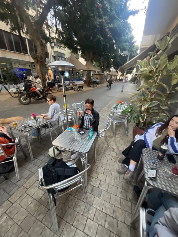 Diners gather at outdoor cafe in Tel Aviv