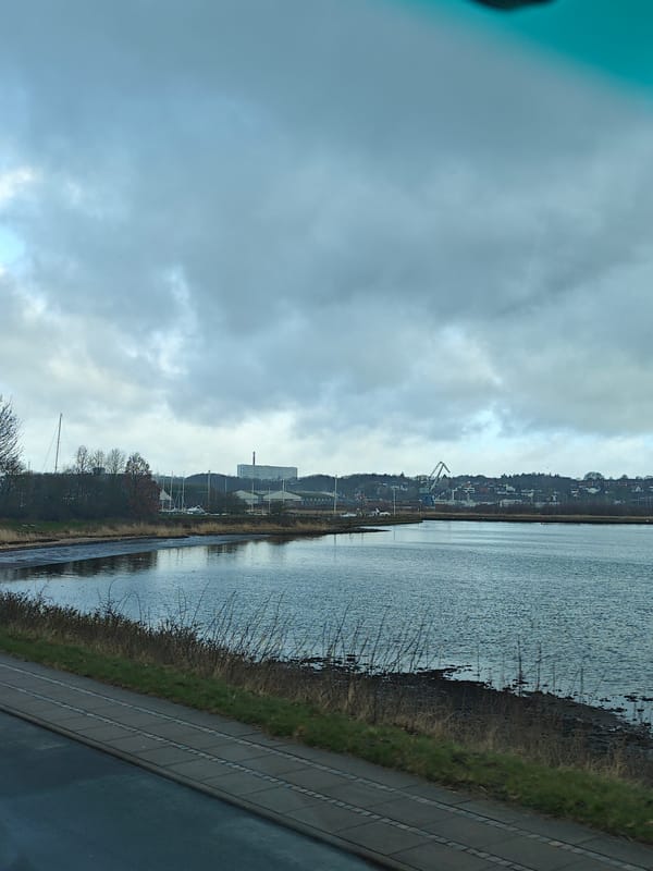 Overcast waterfront scene captured in Kolding, Denmark