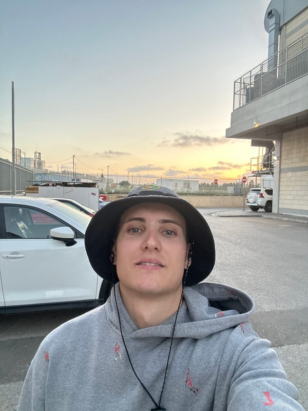 Person takes selfie near white car in Tnuvot