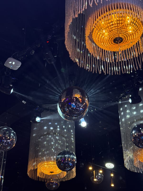 Nightclub interior photographed in Kazan showing disco balls, chandeliers