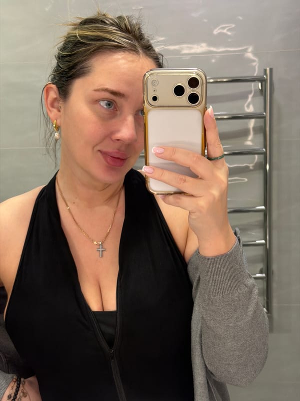 Woman takes selfies indoors in Dolgoprudny, Russia