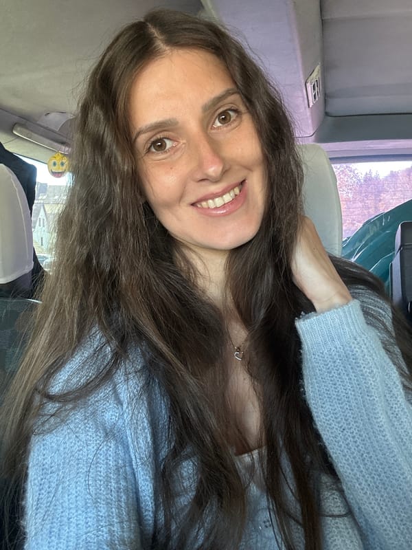 Woman takes cheerful selfie in Wisła, Poland