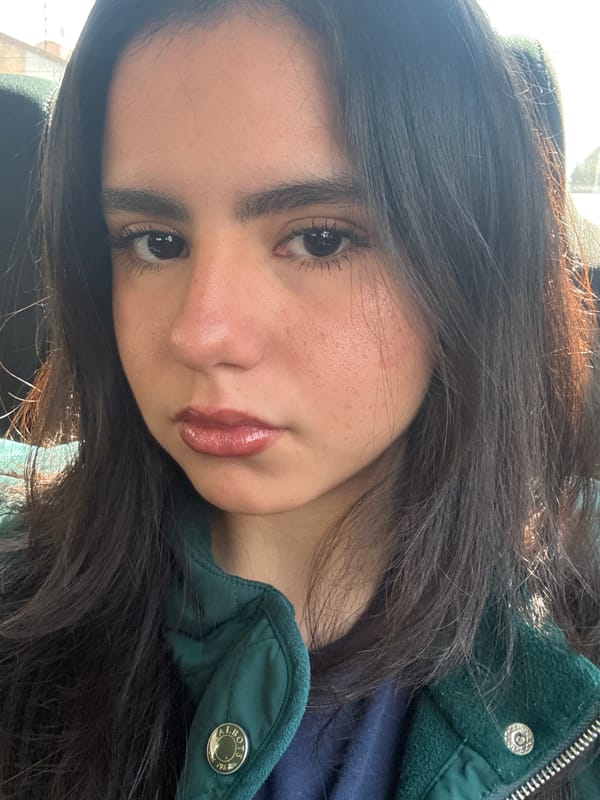 Woman takes selfie in green Talbots jacket in Metepec