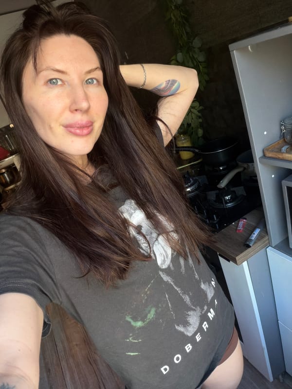 Woman photographed with Stanley tumbler in Perm kitchen