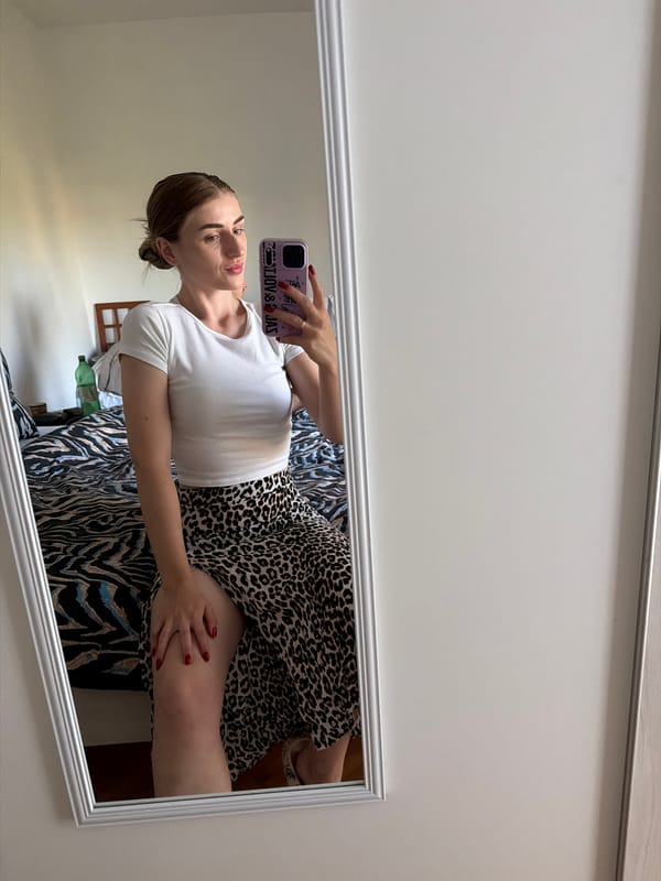 Mirror selfie session: white crop top, leopard-print skirt, multiple angles