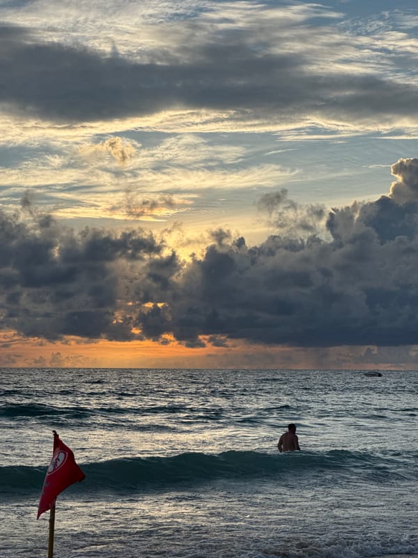 Karon Beach in full afternoon swing, warning flags and all