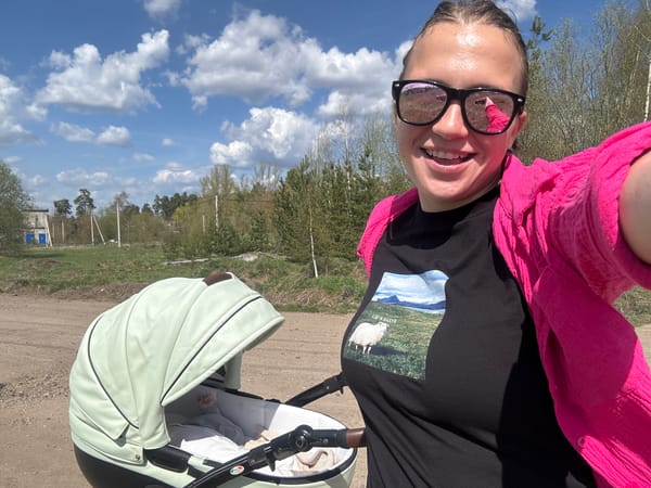 Woman takes selfie while walking baby in stroller, Раздолье