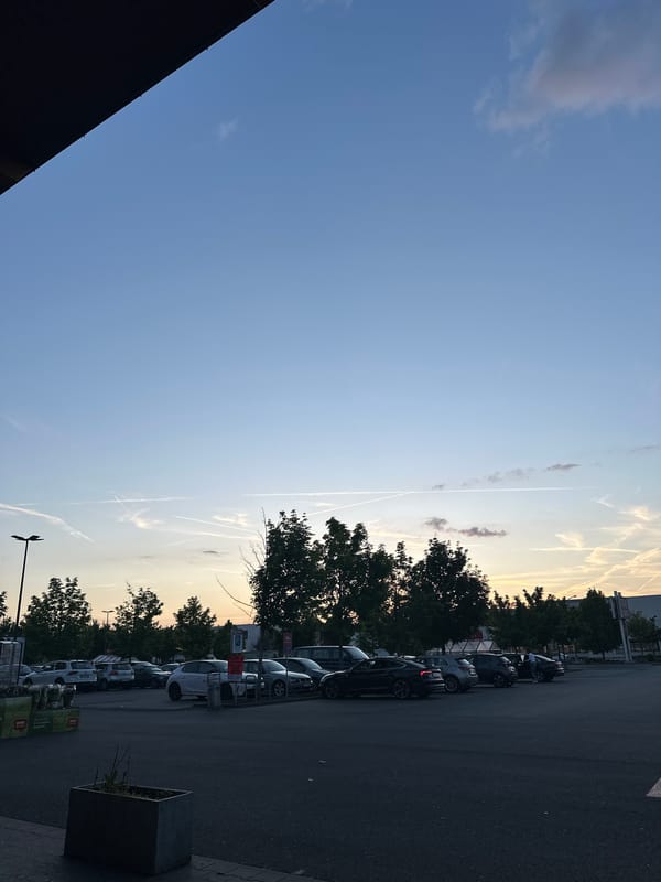Dusk parking lot scene captured in Frankfurt