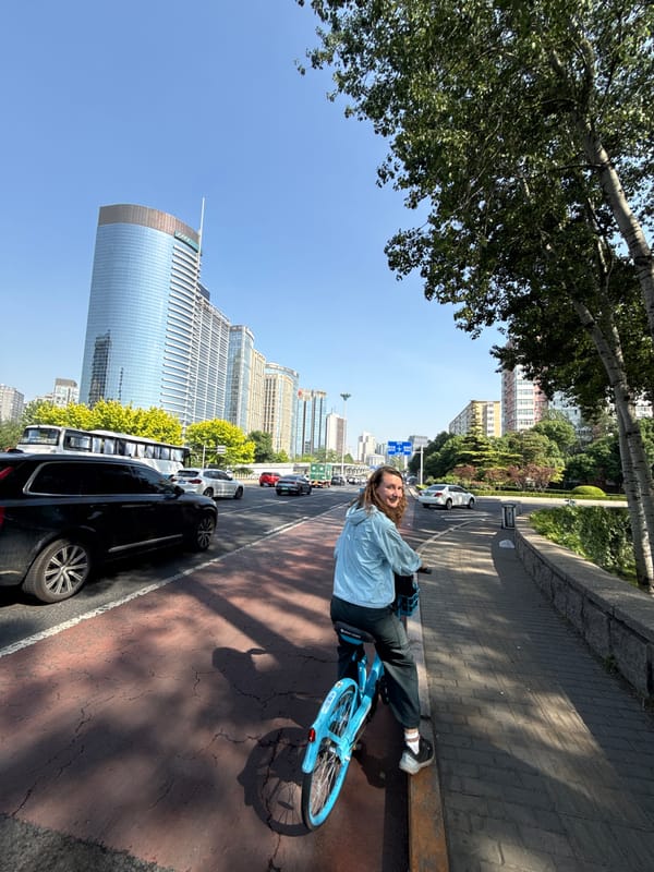Woman with bicycle observed during Beijing traffic jam