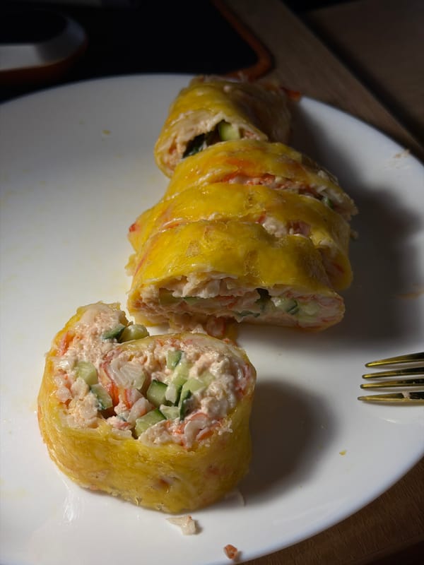 Tamagoyaki sushi rolls with crab and cucumber filling