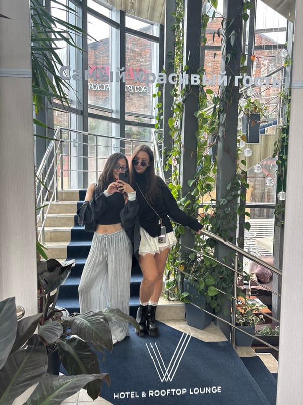 Women pose for photos on Vladivostok hotel rooftop