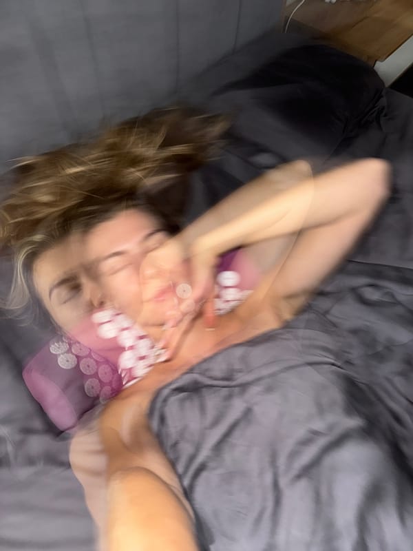 Woman resting in bed captured in multiple photographs