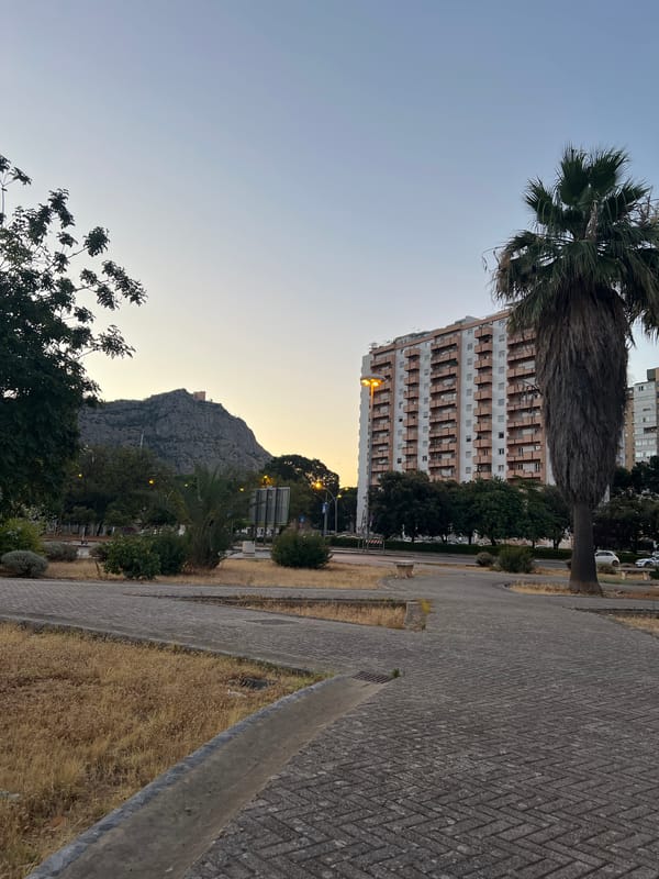 Dusk settles over Palermo's Monte Pellegrino neighborhood