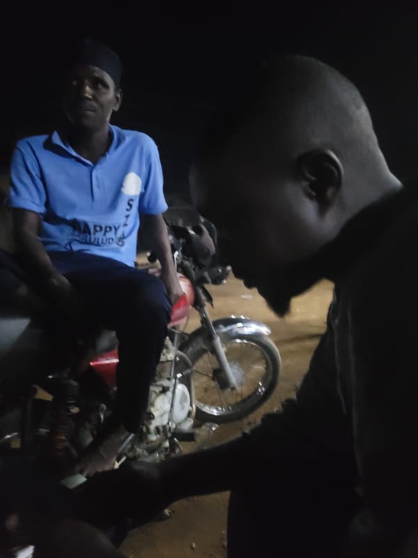 Evening scenes captured in Madalla include motorcycle repair, outdoor gathering