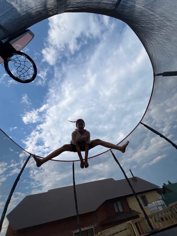 Trampoline jumps against a summer sky in Chaikovsky