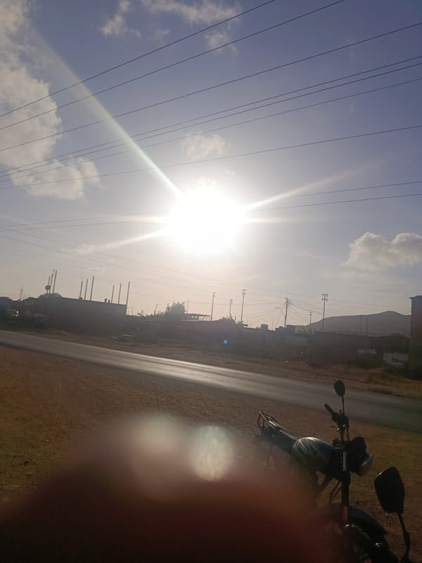 Roadside scenes with motorcycles, vehicles documented in Venezuelan towns