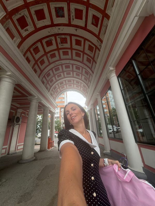 Selfies in a red-and-white arched walkway in Khabarovsk