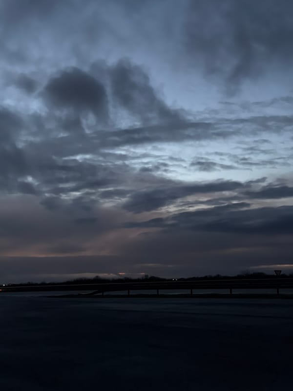 Cloudy dawn sky captured above highway in Kolarovo, Bulgaria